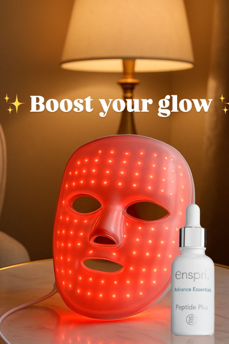 An LED red light therapy mask glowing in a warm home setting, paired with a bottle of Enspri Peptide Plus Serum to boost the skin's glow. Text reads 'Boost your glow' to highlight the synergy between light therapy and water-based peptide serums.